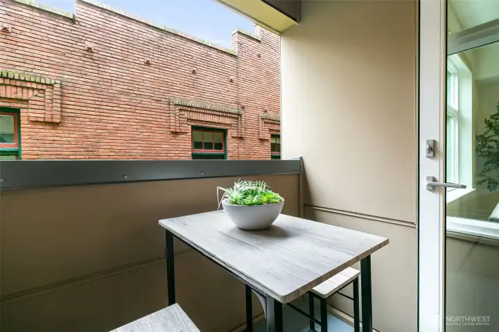 Mornings begin with coffee and evenings end on your private balcony—modern Ballard living at its best.”