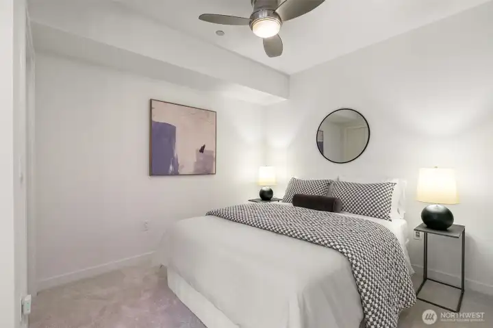 Relax and recharge in the inviting alcove bedroom complete with a walk-in closet and ceiling fan.