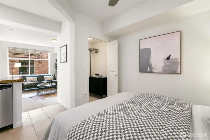 Relax and recharge in the inviting alcove bedroom complete with a walk-in closet and ceiling fan.
