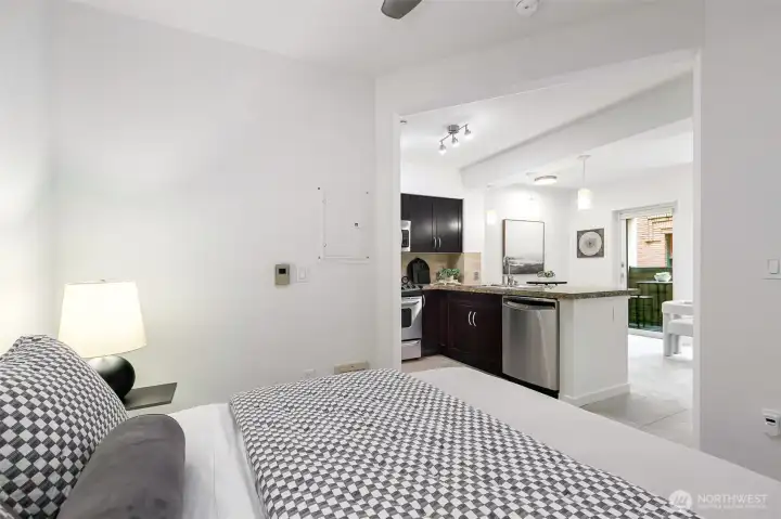 A peaceful alcove bedroom, with a walk-in closet, and a ceiling fan make this space feel like home.