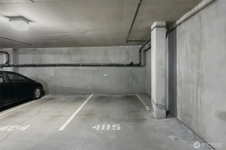 Secure garage parking included, stall 405 (P1).