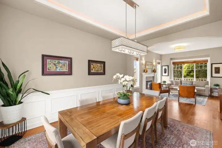 Dining room with coved ceilings and wainscoting.