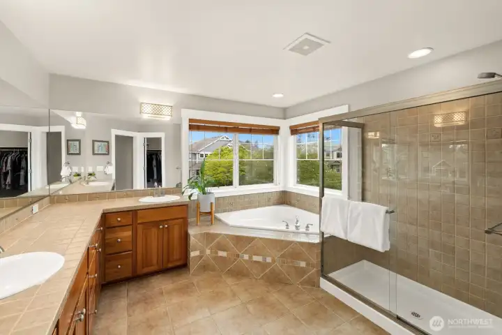 Primary bathroom with soaking tub and separate shower.