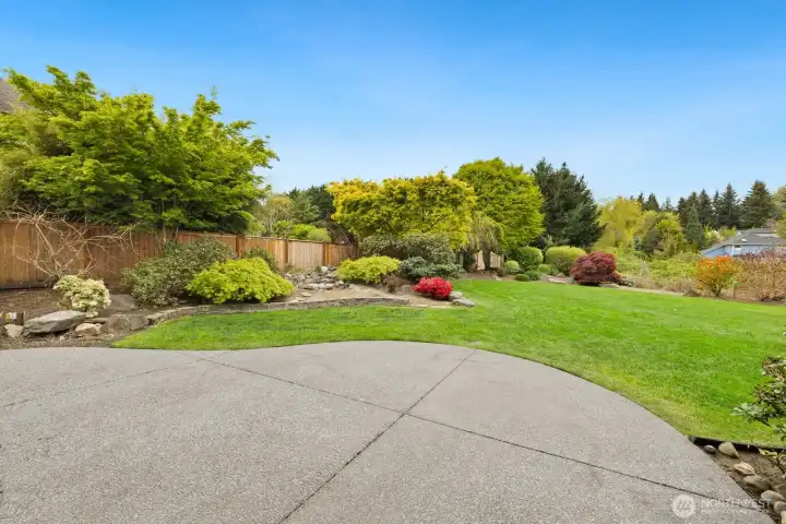 Large concrete patio and gorgeous .44 acre yard!