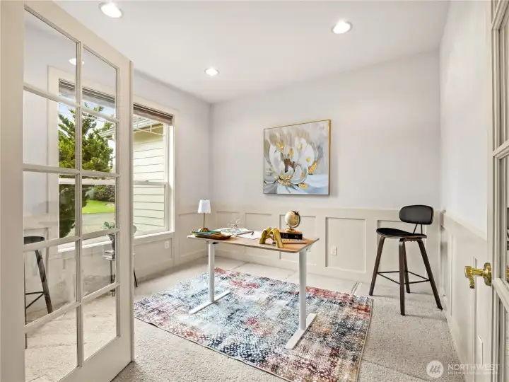 As you step in through the front door, you have a den with wainscotting.