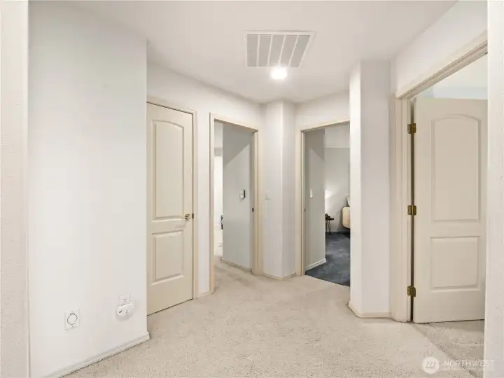 The upstairs hallway connects all the different rooms without creating long narrow spaces.
