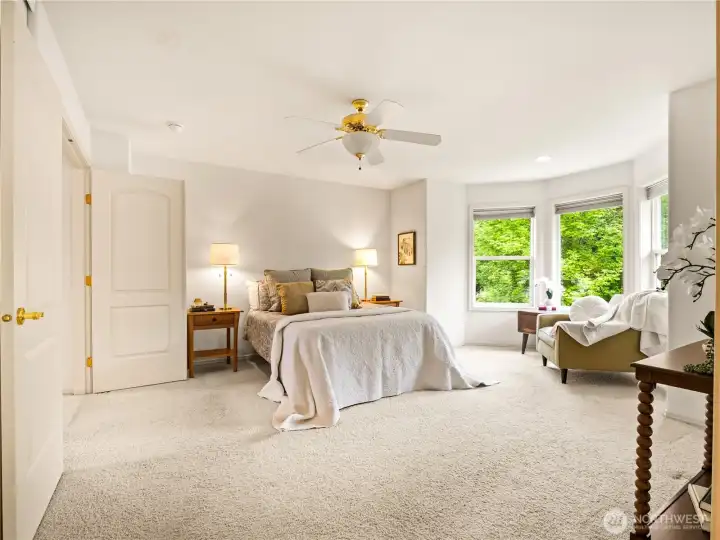 The oversized primary suite is a place to retreat and relax after a long day.