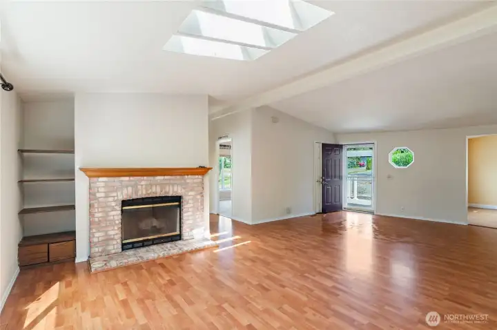 Wood burning fireplace insert and built in shelving.