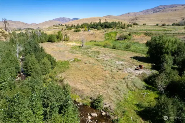 Creekfront and creek bottom area looks back at Farm land and homestead setting. Over 600 Plus feet of Waterfront along Beaver Creek.