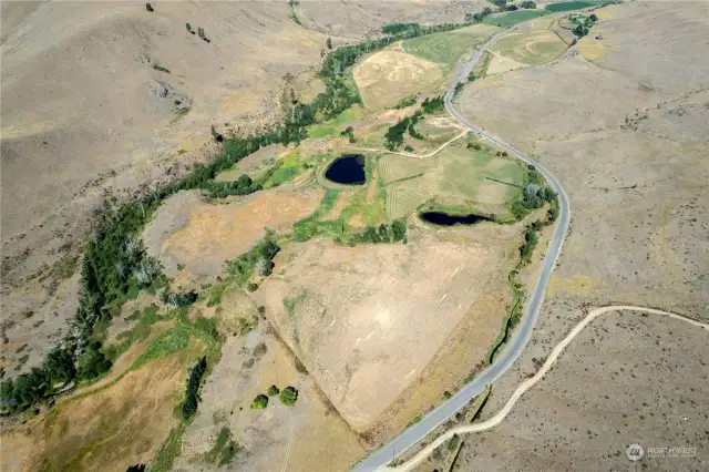 Aerial view of 101 Acres off of Upper Beaver Creek Road, from Ranch driveway to Pond areas , AG areas and Creekfront the settings are natural and groomed with farming and stock use.