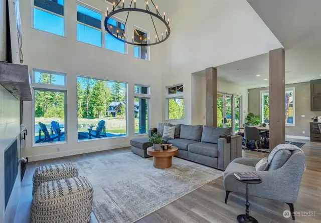 From the moment you step inside, you're greeted by an inviting open-great room that seamlessly integrates with nature, boasting panoramic views of your very own private, stocked pond.