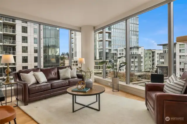 Unit 724: urban views from the floor-to-ceiling windows in the living room. Custom blinds throughout.