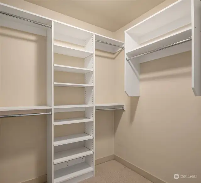 A generous closet with built-in shelving off the secondary.