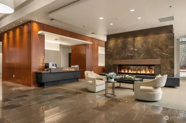 The charming lobby space waiting to welcome you home. This photo captures the concierge desk.