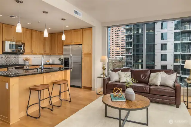 The warm wood tones from the eat-in kitchen in addition to the hardwoods make this space feel cozy.