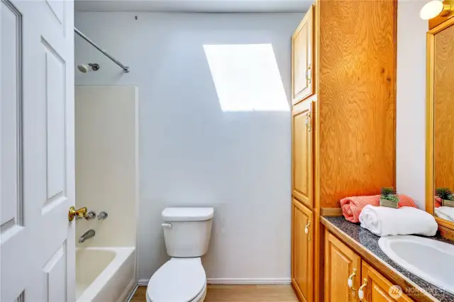 New Toilet. Lots of storage for linens.