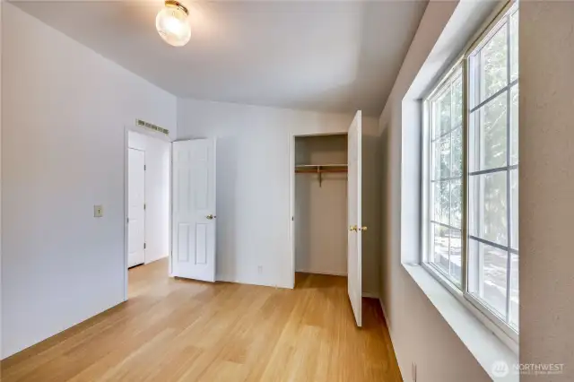 Bedroom #3 with view of the additional closet across the hall.