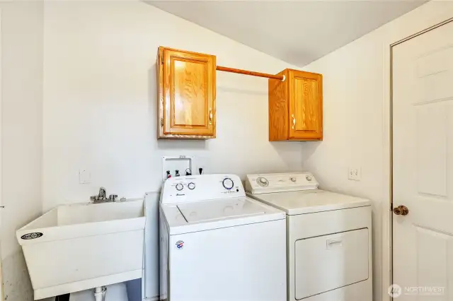 Utility room off of the kitchen. Door goes to the garage.
