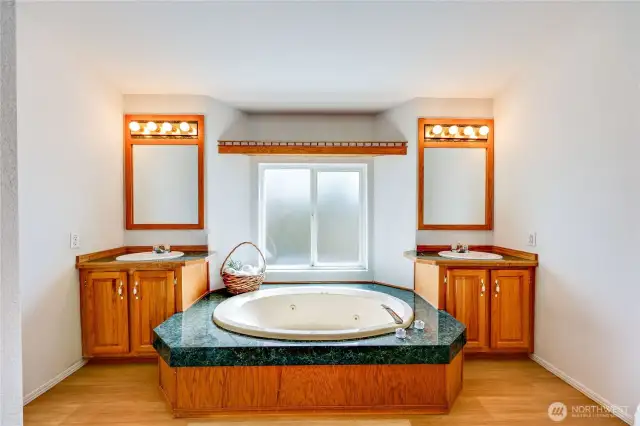 Double vanities and jacuzzi tub.