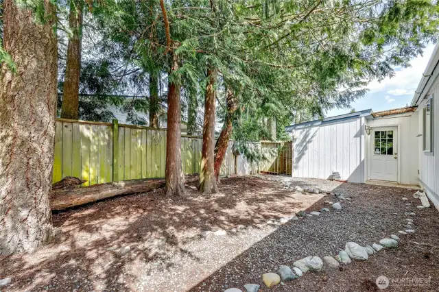 Door leads to the garage area. There is an extra storage area as you enter.