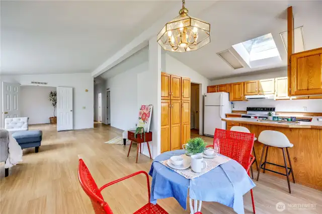 Dining area off of the kitchen.  Through the door next to the refrigerator is the door to the garage and utility room.