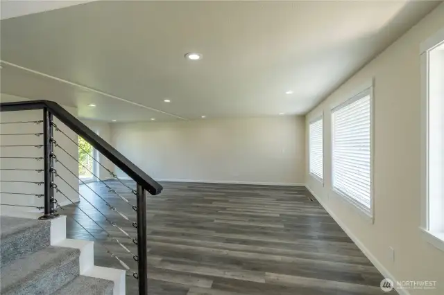Stairs to upper level with 4 bedrooms and two full bathrooms.