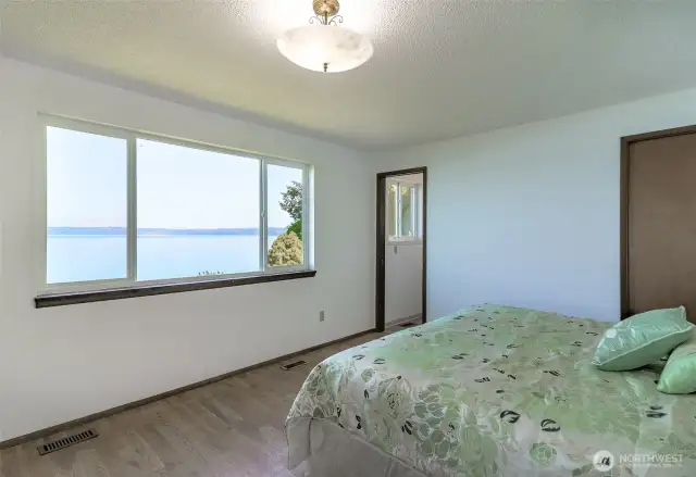 views from the primary bedroom and access to the deck