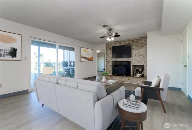 downstairs family room/fireplace   virtual staged