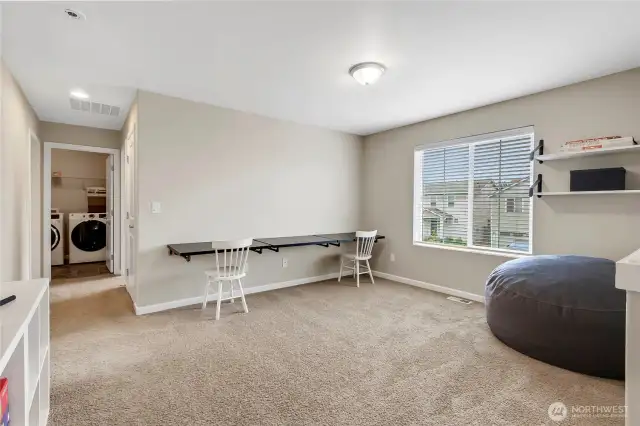 Loft area with built-in desks