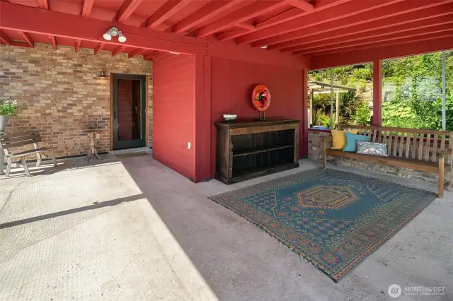 Carport, currently used as an entertaining area, storage, and Sauna.