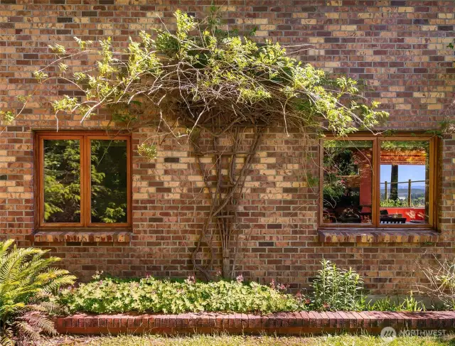 Whimsical exterior, made of brick, wood, and stucco.
