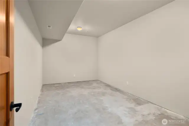 Unfinished room that leaves your imagination to run wild. Make this room into a wine room or a small theater room. Check out the next few  virtually stage photos for this room.