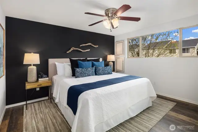 Large primary bedroom with double closet and additional walk-in closet
