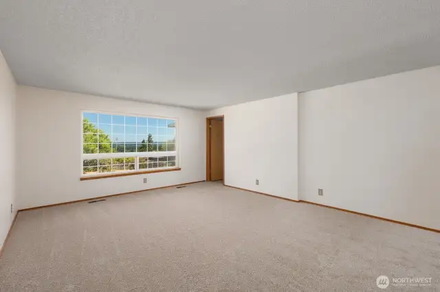 Another angle of the living room. The door in the back corner leads to the kitchen/dining area.