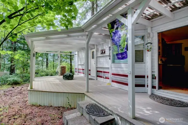 Park model trailer with a large covered deck