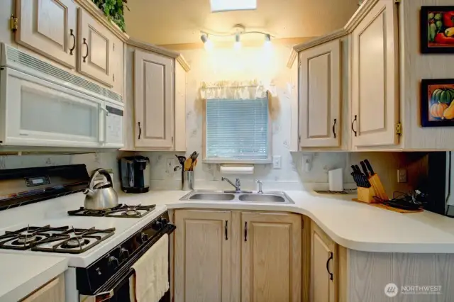 Kitchen with stove and microwave