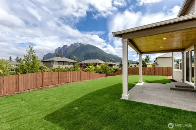 Photo rendering is representational. Actual home is under construction and finishes, elevation, and paint colors may vary. See site agent for details. Views of Mt. Si from a neighboring home. Covered patio.