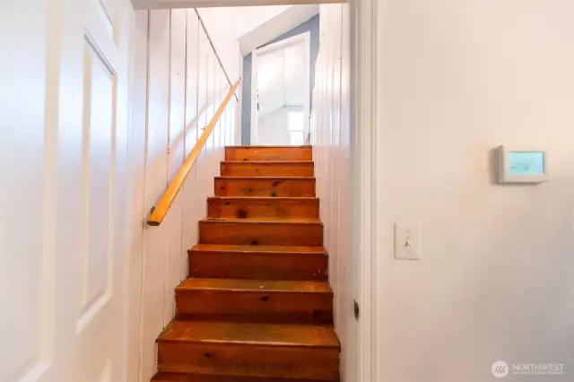 Up the stairs from dining room to another potential bedroom.