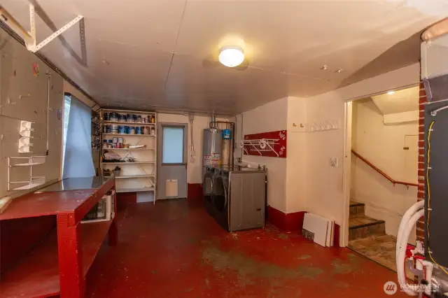 Attached garage is currently used for laundry and storage, but could be converted back. Washer & dryer are just 4 yrs old and are included. Door at center is backyard access.