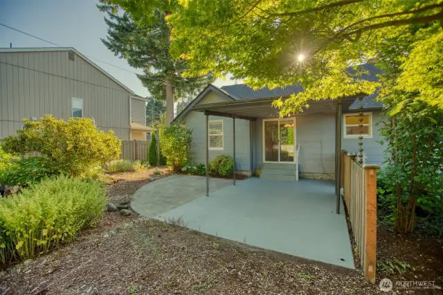 Covered back patio is adjacent to your dining room. In the past it's been used as a carport via the clear path to vehicle gate off the alley.