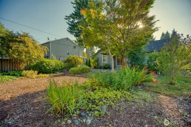 Lovingly tended perennials ensure a gorgeous mix of color & greenery that will return year after year. These landscaped gardens were the owner's happy place.
