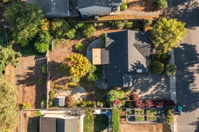 Aerial view of this adorable westside home on large lot & tucked in among multiple patios and an incredible landscape!
