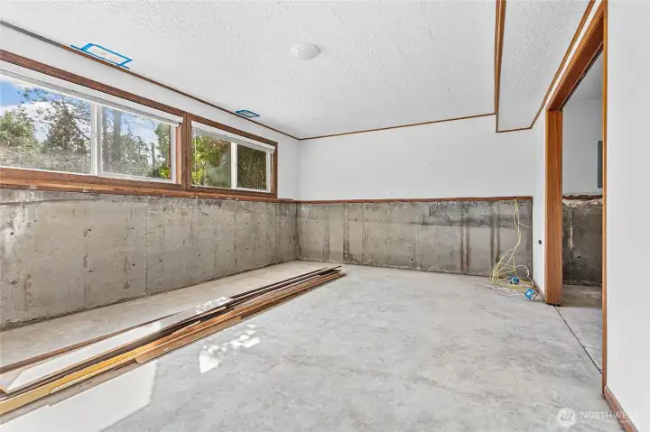 Downstairs living - recent water damage. Professionally dried and transferable lifetime warranty waterproofing to be completed in November!