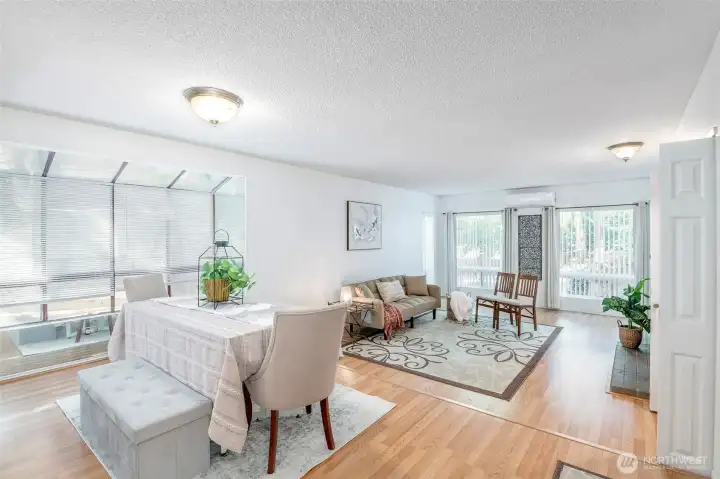 Gorgeous open flow from your dining to living room.