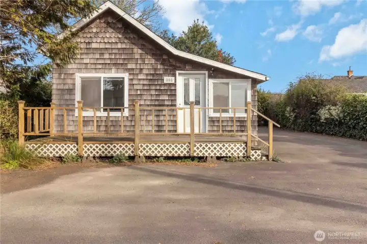 Prime Pacific Way frontage with excellent visibility—zoned Community Commercial, offering endless potential for business, vacation rental, or full-time living.