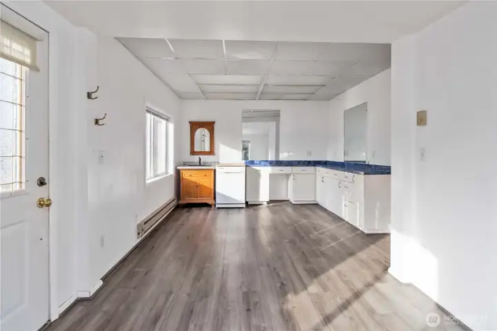 Unique built-in sink and dishwasher add convenience—ideal for a salon, studio workspace, small café concept, or easy conversion back to traditional living space.