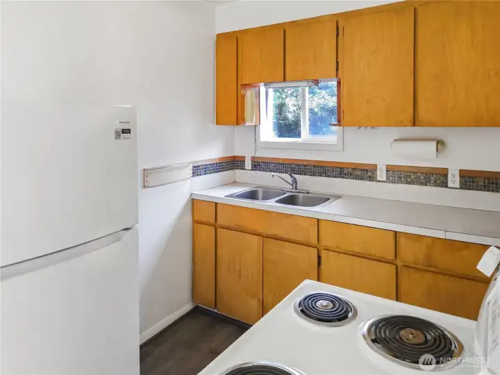 Fridge, stove, and all the essentials—space to eat-in or stroll down to your favorite local dining spot.