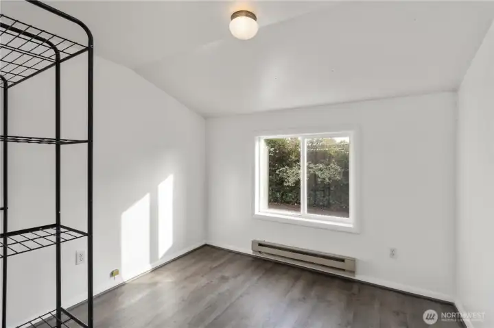 Cozy bedroom suitable for a private office, treatment room, guest space, or comfortable sleeping quarters.