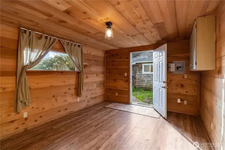 Detached bonus shed with natural cedar scent—great for dry storage, hobbies, or additional work/guest space.