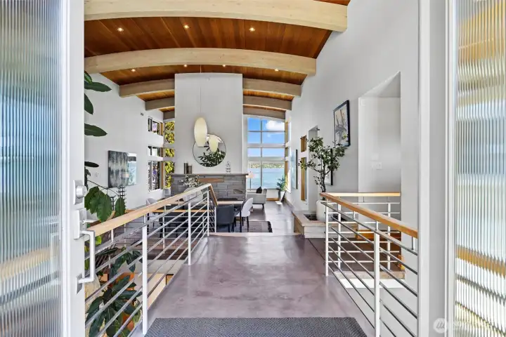 Architecturally significant 6,488 home with elegant atrium entry built around huge standing granite stone monolith, custom barrel ceilings.